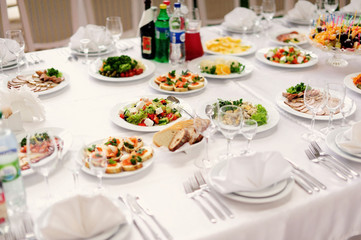Fototapeta premium table set service with silverware and glass stemware at restaura