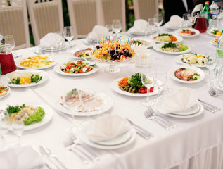 table set service with silverware and glass stemware at restaura