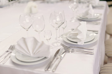 Served table in restaurant with dishes and glasses