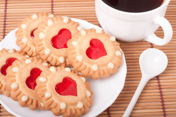 cookie with heart  jelly and cup of coffee bamboo napkin