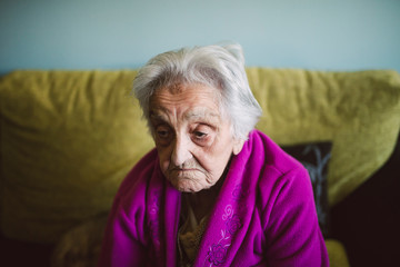 Elderly woman with sad expression