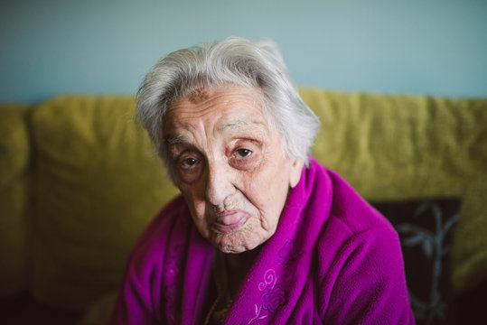 Elderly woman sticking out her tongue