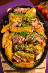 meat with potatoes in pen