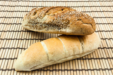 whole wheat bun on wooden mat
