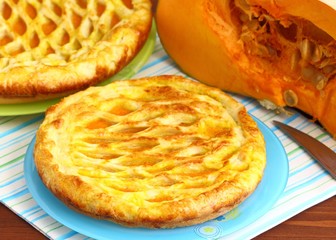 A pumpkin pie on table