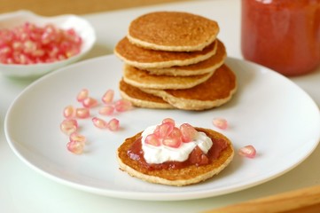 Pancakes with marmelade, pomegranate, cottage cheese and coffee