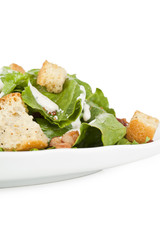 cropped plate of caesar salad