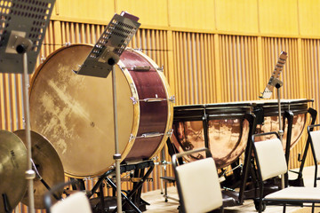 group of classical percussion instruments on a large wooden stage
