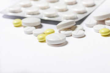 pills close up on white background. medications