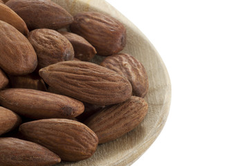 almonds on wooden spoon close up