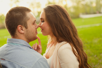 Fototapeta premium Happy Smiling Couple Relaxing on Green Grass.Park