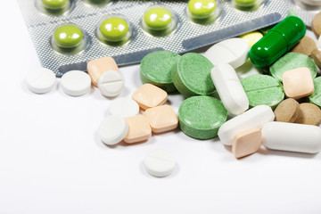 Pills close up on a light background.