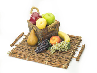 tasty summer fruits in backet isolated on white