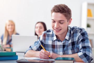 Male student studying in the class