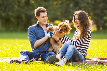 Fototapeta premium Lifestyle, happy family of two resting at a picnic in the park w