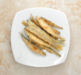 fish smelt  fried in a plate