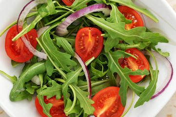 vegetable salad - cherry tomatoes, arugula, red onion