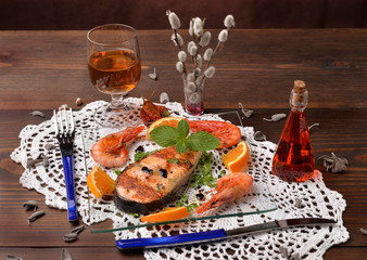 Salmon Steak and shrimp cooked on the plate