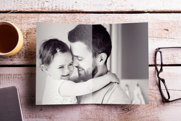 Fathers day composition. Picture of father holding his daughter