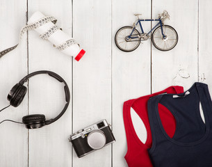 Travel and sport concept -  bicycle model, shirts, headphones