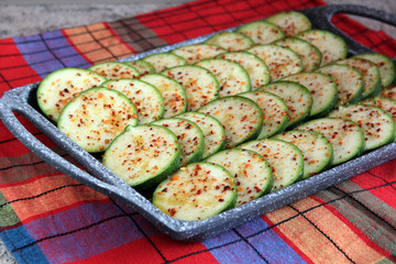 Served fresh baked spicy zucchini, sliced, marinated in olive oi