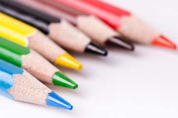 Fototapeta premium Colour pencil isolated on a white background. Lines of pencils. Education concept. Lots of asorted color pencils. Color palette.