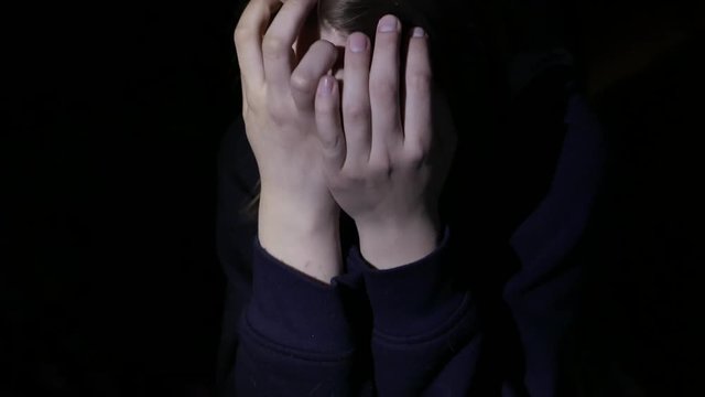 Unhappy sad teen girl. Domestic violence and abuse concept. 4K UHD
