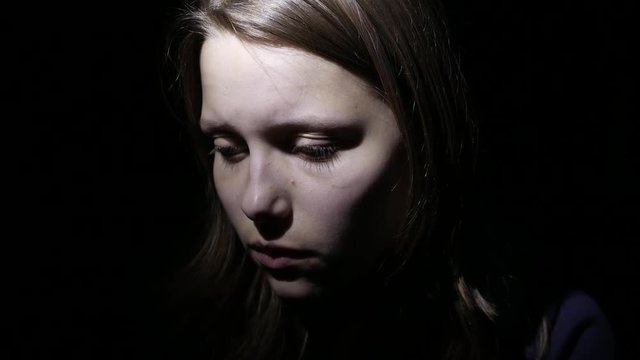 Stressed teen girl fear of something and says to do silence. 4K UHD.