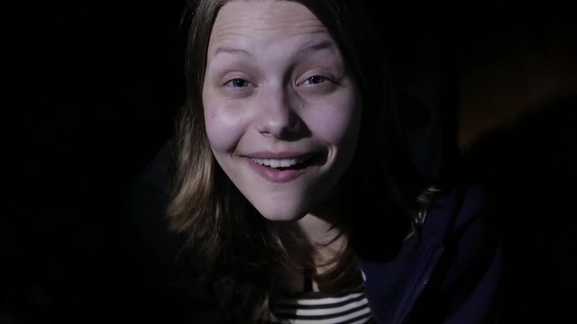 Teen girl making offensive gesture. Young antisocial hooligan with dirty makeup. 4K UHD