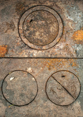 Rusty weathered antique cast iron wood stove burner cover plates