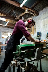 Fototapeta premium Carpenter working on his craft