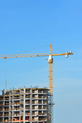 Crane and highrise construction site