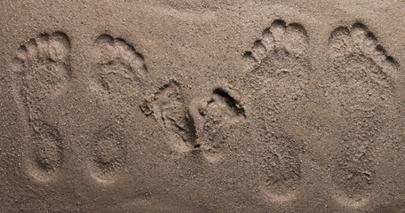 family footprints on sand