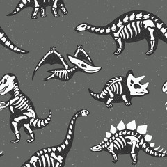 Adorable seamless pattern with funny dinosaur skeletons in cartoon style