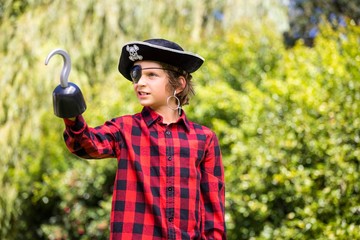 A kid is playing in costume of pirate