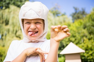 A kid is doing a funny face