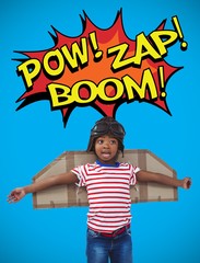 Composite image of smiling boy pretending to be pilot