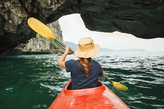 Woman explore Ha Long Bay on kayak