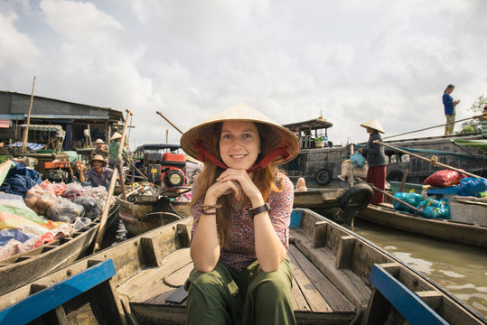 Woman tourist explore vietnamese culture in Mekong Delta river