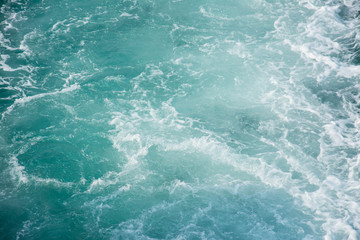 Fototapeta na wymiar sea wave behind the boat