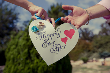 a paper heart with the words happily ever after