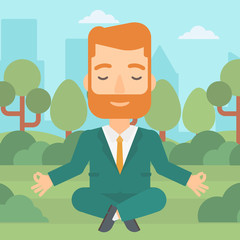 Businessman meditating in lotus pose.