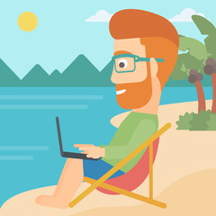 Fototapeta premium Businessman sitting in chaise lounge with laptop.