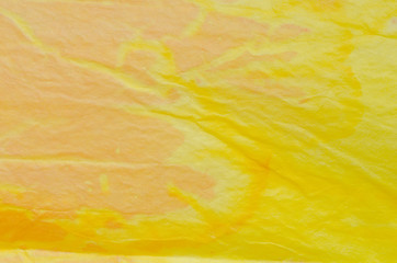 yellow painted crepe paper background