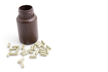 Herbal medicine capsules on white background with copy space