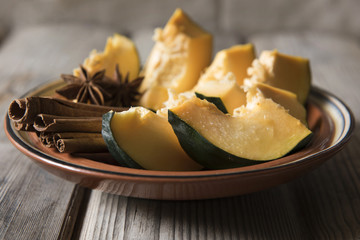 Pumpkin in a clay dish with spices