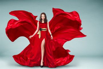 Woman in red fluttering dress