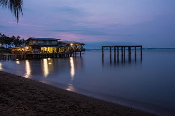 Fototapeta premium house on the beach with sunset over the sea on koh chang island, Thailand