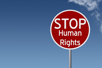 Round highway road sign with text stop human rights