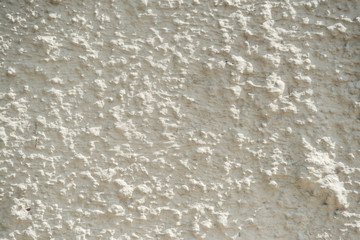 Aged cement stucco rough wall texture. Hard light.